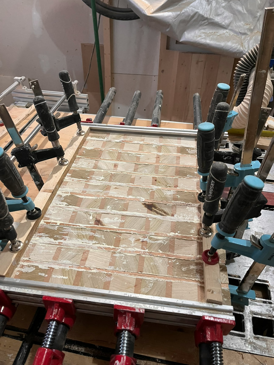 End-grain cutting board in clamps