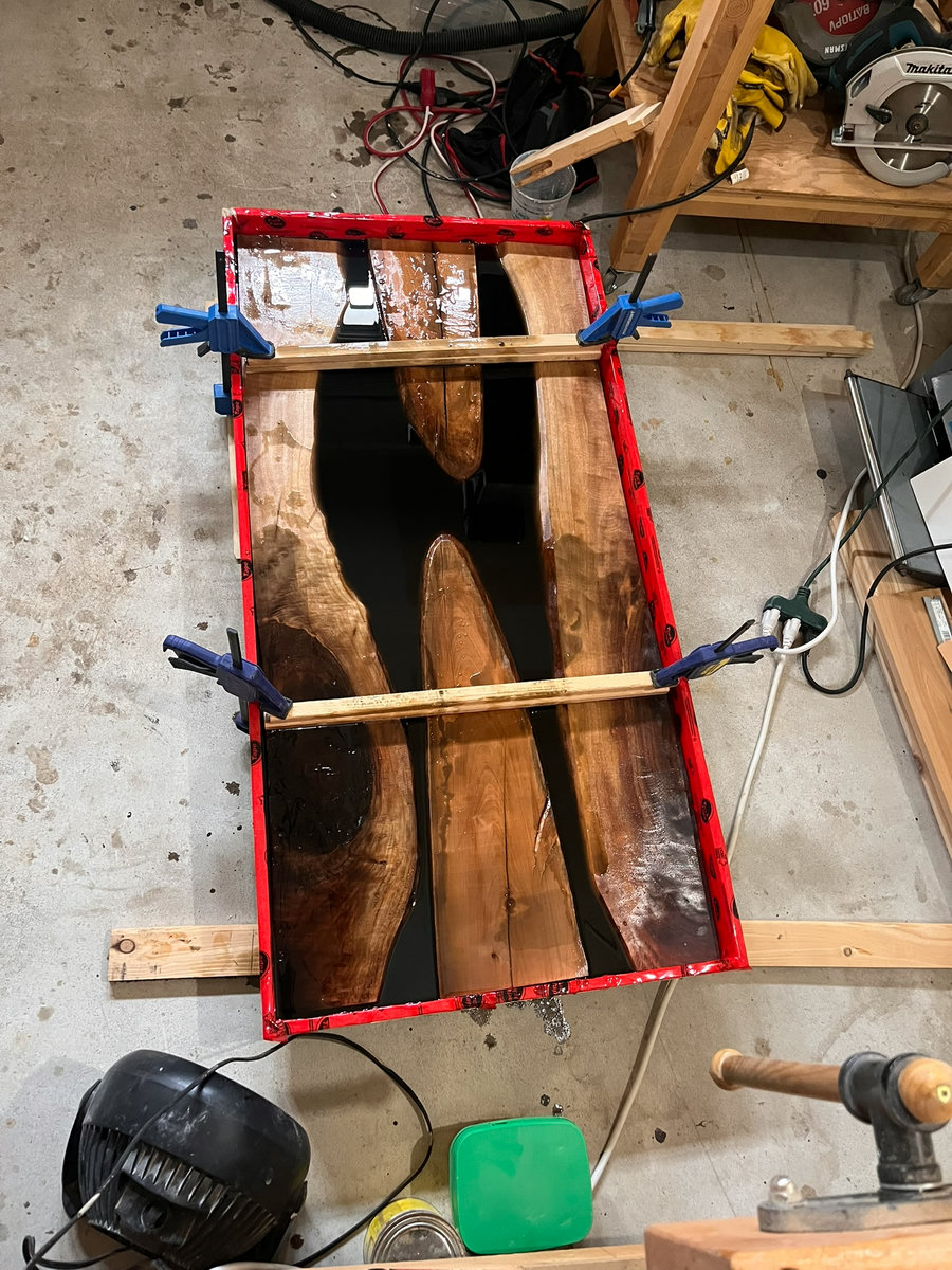 Epoxy coffee table — resin pour in progress